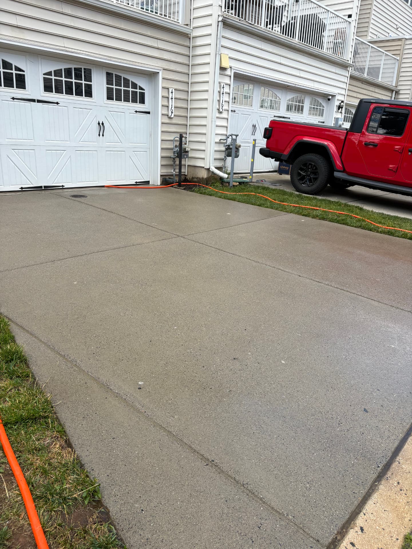 Clean concrete driveway after pressure washing in Loudoun County VA
