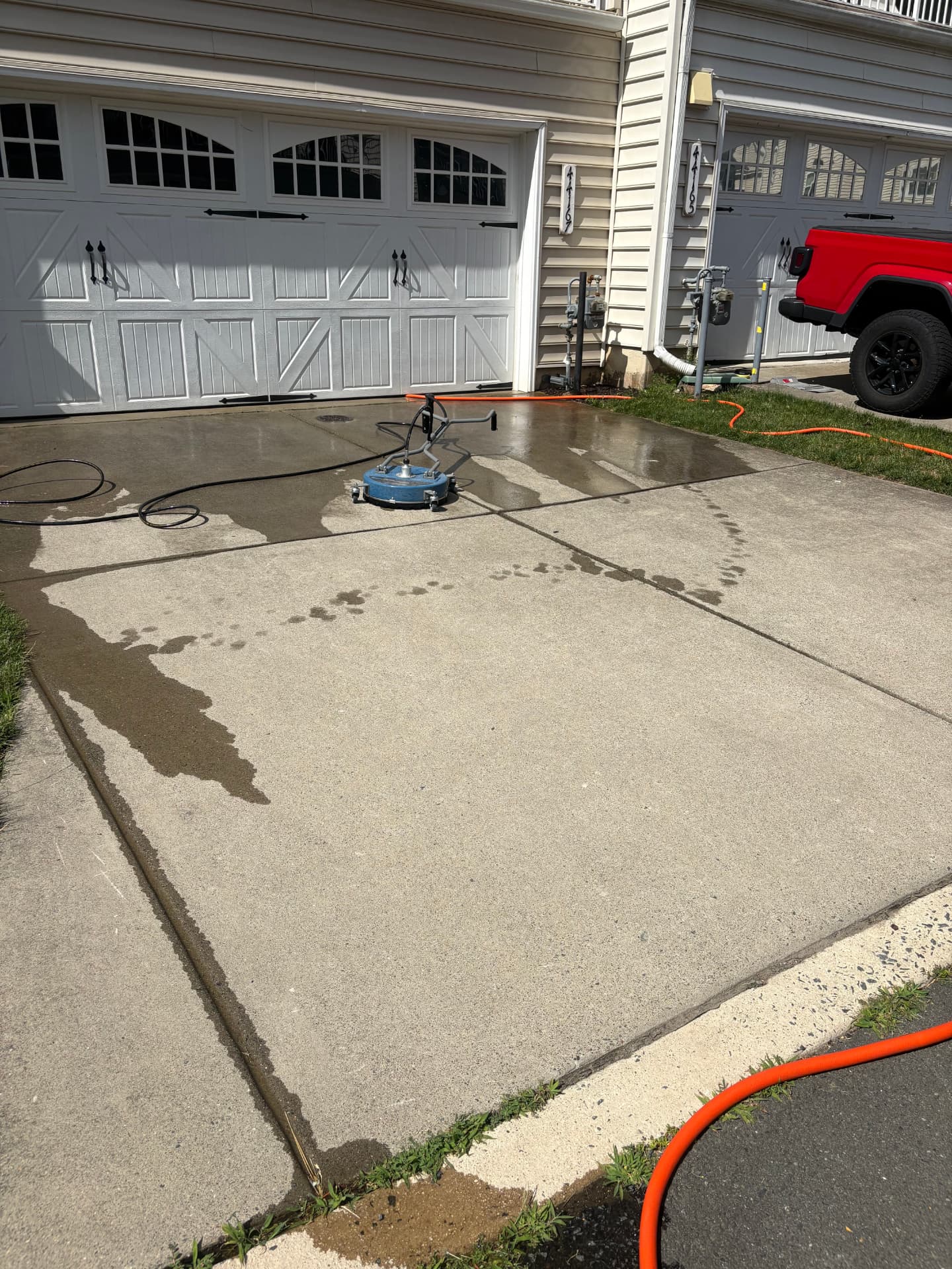Dirty concrete driveway before professional surface cleaning in Loudoun County VA